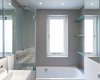 Redesigning the cramped bathroom was one of the project’s biggest challenges. The original space had small and dated bath fittings, as well as intrusive plumbing pipework. The entire bathroom was taken down to the studs and pipes were redirected. The chimney was removed from the adjacent bedroom, increasing the available interior space. The tile floor in the bathroom is the only new flooring in the entire house. Photo of A Compact, Light-Filled Victorian Renovation in England modern home