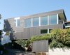 “Through the thoughtful consideration of how spaces are used, how they obtain natural light, how they obtain natural ventilation, and how they relate to the site, less materials were used in construction, and less energy is needed to live in the house,” Hutchison says. Photo 9 of Portage Bay Bungalow modern home