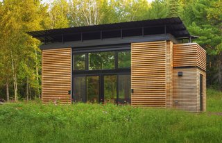 In September 2009, Bill and Daniel Yudchitz bought a 2.78-acre lot that had water access to Lake Superior’s Chequamegon Bay. Many of the properties they looked at required a larger minimum building footprint than they desired; their cabin needed to be small to reduce its environmental impact.