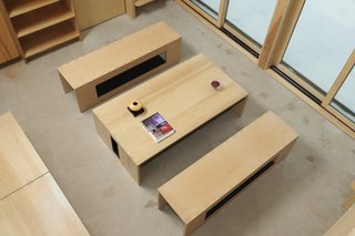 It quickly becomes a coffee table when its legs are folded inwards and hidden underneath the tabletop.