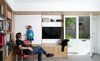 This innovative family home in San Francisco’s Mission District includes a library/media room where a rolling chalkboard panel conceals the TV when not in use. Photo 4 of KS Mission modern home