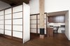 While the homeowners were inspired by shōji screens, the challenge was how to secure them. Gepetto’s solution was a sliding three-panel screen anchored at one end of the wall unit. Photo 4 of Brick House modern home