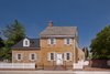 “The existing house was an important house in the heart of the historical district,” architect Robert Gurney said. To honor the property’s legacy, and fulfill the city’s requirements, the firm fully restored the exterior with cedar shingles. Photo of A Traditional Facade Hides A Light-Filled Modern Delaware Renovation modern home