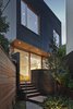 “The black siding is contemporary, but the texture of the wood grain is friendly and complements more traditional neighboring houses,” Clarkson said. Windows are fabricated with Douglas fir. Ipe and stained black cedar make up the home’s various decks. Photo of King West modern home