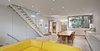 Unlike the home’s dark exterior, its bright interior “incorporates large skylight elements, generous windows up to the ceiling, and an operable sliding glass wall facing the garden,” Clarkson said. ROSS Windows & Doors allowed for the airy concept throughout the property. Photo 4 of King West modern home