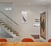 A custom glass structure supplied by Reale Born Inc. borders the stairs, which are made of solid white oak. Photo 5 of King West modern home