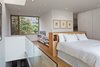 Benjamin Moore’s Ultra White CC-10 was painted throughout the interior, including in the third floor’s master bedroom. The house has five bedrooms, and two are used as personal offices. Photo 7 of King West modern home