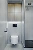 The tiles are also from Hisbalit, though green-grey and rectangular. The shower tap is from Omnires. Photo of A Sleek Kitchen and Double Bathroom Renovation in Prague modern home