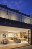 Modern home with Living Room. A folding window wall opens onto the East-facing deck, creating an ideal indoor/outdoor common area. The living room features a Ligne Roset Feng sofa and custom Tai Ping carpet. Photo 7 of Noe Residence