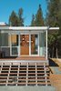A longtime fan of the Case Study houses of the late ‘50s and early ‘60s, Terry Ohm was attracted to the iT House, by Taalman Koch Architecture, for the design’s “transparency and minimalism.” His customized, smaller-scale version stands on a rural plot of land in Lake County, California. Ohm sits on his broad front steps often and appreciates their strong visual impact: “The house is so little, you’ve gotta go for grand wherever you can get it!” Photo 2 of Mayacamas Residence modern home