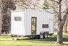 Fed up with boxy trailers that blot out their scenery, F9 Productions developed ATLAS as an airy alternative for road travel. Part of a series of projects that experiments with practicality, the trailer clocks in at 7,500 pounds, with 192 square feet of interior space spread across two levels. Photo of A Tiny Trailer Home Harvests Solar Power and Rainwater to Save Energy modern home
