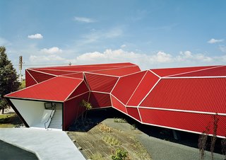 The resulting building, its angular form inspired by Japanese origami—was designed and built in two and a half months in early 2007.