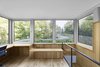 A small box atop the home looks out onto a green roof, designed by local landscaping firm Toits Vertige. Photo 7 of House of Lake Grenier modern home