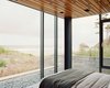 Modern home with Bedroom. The linens by Matteo Los Angeles in the master bedroom were among the fabrics that Mirjana Munetic of Boora selected for the Finleys. The idea was to find neutral tones that would not upstage the views. Photo of These Modern Glass Homes Shatter Conventions