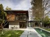 Modern home with Exterior, Flat RoofLine, and House Building Type. The Bigelows’ house throws a nod to its midcentury modern neighbors with its subdivided plan and shallow-pitched roof. The three pavilion layout was also partly in response to tough city restrictions regarding the removal of the various beech and redwood trees on the property. However, the Butler Armsden design team was able to use the profusion of trees to their advantage, creating lines of sight to foliage from almost anywhere in the house.
The exterior features locally reclaimed redwood siding that provides another connection with the redwoods on the site. The stucco is painted in custom color-matched Benjamin Moore paint. Photo of A Couple Puts Their California Home on Track for LEED Certification