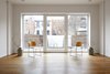 Architect Paul Castrucci found that when designing a passive house for an urban environment, he didn’t have to take many extreme measures as long as the apartment layout was smart and strategic. Like many efficient homes of this caliber, the 13-16 inch thick walls provide serious insulation and a tight envelope. Photo of R-951 modern home