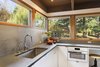 Miele appliances were used throughout the kitchen, alongside a Grohe Concetto faucet above the sink. Photo 6 of City Skyline modern home