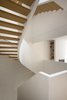 The primary living space is on the second floor, where side shelves in rift-cut white oak match the treads of the central staircase. The hand rails are blackened steel. Photo 3 of White Oak modern home