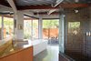 Modern home with Bath Room and Freestanding Tub. Fleetwood Windows & Doors provided the dual-glazed panes throughout the home. Photo of This Home's Design Took 72 Drafts to Get Right