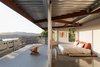 Modern home with Bedroom, Bed, and Concrete Floor. “By shifting the 60-degree equilateral grid of the home 18 degrees, it blurred the edges of the lot line so that the user isn’t sure where the property starts or ends,” Marble said. The hexagonal shape also makes the most of passing breezes, changing sunlight, and bird’s eye views. Photo of This Home's Design Took 72 Drafts to Get Right