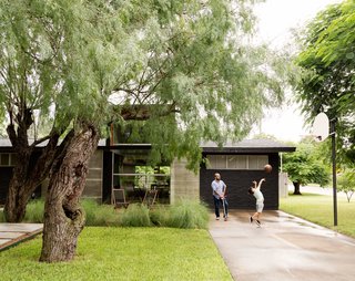 López insisted on a concrete pathway that winds through the trees, so visitors don’t have to enter through the driveway.