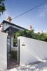 As a nod to local history, the designers kept the home's original street-facing Victorian facade. Photo of Seclusion modern home