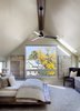 Modern home with Bedroom, Chair, Recessed Lighting, Carpet Floor, Table Lighting, Bed, and Dresser. Since this home was primarily for the couple, rather than their grown children, they wanted a luxurious master bedroom. A Kichler fan circulates air above the bed. Photo 5 of Highlands House