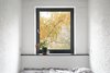 The plaster on the bedroom wall was too hard to remove, but Vorontsov is glad the clients kept it; its unique texture adds dimension to the six-foot-wide bedroom. It owes its tiny size to two bearing walls Crosby Studios had to work around. Photo 7 of Soviet Intelligentsia modern home