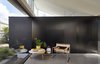 Modern home with Living Room, Chair, and Concrete Floor. “We kept the tones very neutral because we wanted the colors of the garden to come through,” Ong says. “Light also plays an important role here, and again the neutral tones help highlight the changes in the light and sky.” Ong’s team used Melbourne's Ajar Furniture and Design store to supply the home's furnishings, and this Marcel Breuer Club Chair Model B3 sits off the dining room. Photo 3 of Breeze