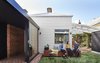 Ong refers to the open space between the old and new structures as “the void,” and he says it's meant “to enhance the ‘pavilion’ concept" of the dwelling. Four sets of sliding glass doors surround the space. Photo 6 of Breeze modern home