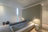 Design classics like the Tolomeo wall sconce and Componibili table round out the bedroom. Photo 7 of Villa R modern home