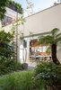 Modern home with Outdoor, Grass, and Back Yard. She also designed the table, surrounded by vintage Wishbone chairs by Hans Wegner, in her studio. Photo of 17 Modern Homes With Hans Wegner Furniture