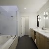 Only one shade of paint was used in the interior of the home, including the bathroom: Sherwin-Williams's Harmony. Photo 7 of The Farmhouse modern home