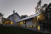 A guest basement sits under the master suite toward the back of the home. Jeld-Wen Windows & Doors provided the aluminum-clad wood panes seen on each level. Photo 8 of The Farmhouse modern home