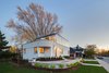 The home's white stucco exterior is actually a thin layer of stucco spread over a modern EIFS (Exterior Insulation and Finishing System) from Dryvit. Photo 9 of Art Moderne modern home