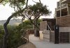 The Carmel Valley Ranch recently received an expansion courtesy of San Francisco–based interior designer Nicole Hollis. In the 12 new suites, Hollis riffed on California ranch–style interiors, translating the comfortable, cozy, and rustic elements for which the style is known. "The ranch theme touches on the locale and history of the original ranch in Carmel Valley," Hollis says. "Our approach in this regard was materials based. We incorporated elements from the property, like salvaged wood and rope. These are simple details and honest materials." Photo of A Serene Hotel in Carmel, California modern home
