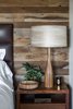 Modern home with Bedroom, Bed, Table Lighting, and Night Stands. A vintage wood lamp and turned bowl stands next to the bed. "We wanted to incorporate elements used in residential homes," Hollis says of the eclectic medley of accessories and furnishings in the space. "These would be items that you would collect over time. They don't exactly match, but they all work together—they create a relaxed casual environment while still elevating the interior and amenities to what you expect from a world-class luxury property." Photo of A Serene Hotel in Carmel, California