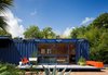 While shopping for containers, the resident of this San Antonio shipping container home was instantly drawn to this one’s existing blue color and chose to buy it and leave it as is. The architect added floor-to-ceiling sliding doors to allow light in, as well as a cantilevered overhang to shade a window on the left side, which houses a small garden storage area. Photo of Blue Mood: 9 Creative Ways to Use Color modern home
