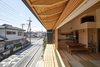 Modern home with Outdoor. The sliding wood and glass panel alludes to traditional Japanese shoji screens—sliding partitions constructed of wood and translucent paper. For the house’s wooden construction, co-design studio used Japanese cedar, sugi, and Japanese cypress, hinoki, both local to the larger Saitama prefecture. Photo 3 of Yanagisaki House