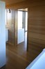The interior walls and floors are carbonized bamboo; this material consists of regular bamboo flooring treated with steam to create a darker and richer color. Photo of Petite Prefab with Stunning Views of the Texas Landscape modern home