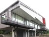 “A majority of the house is lifted on concrete columns to maximize the views and also provide a covered ground plane for protected parking and outdoor living,” Mulvena says. “Future additions to the house can be built on this ground level within the existing structure." Photo 2 of Hudson Valley Dream Retreat modern home