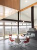 “The windows and patio doors, all made from super low-E insulated glass, open onto the amazing views and give easy access to expansive decks and a pool terrace,” Mulvena says. His team conducted solar studies and installed a retractable screen from MechoShade that would shade the house in the summer. Photo 4 of Hudson Valley Dream Retreat modern home