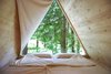 Modern home with Bedroom and Bed. The units don't even require foundations—simple ground screws from Krinner are enough to support them. Photo of The Prefab Glamping Experience You've Been Waiting For