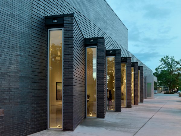 Exterior benches made of local stone establish a relationship between the building and the surrounding landscape, as does the Dark Ironspot Velour Modular Brick from Endicott Clay used on the facade. The design team, led by Deborah Berke, achieved an open, inviting feel through skylights, light monitors, large windows and an interior courtyard.