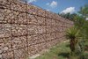 As we were driving around, I spotted this incredible gabion fence. Massive and perfectly arranged, the fence surrounded a privately owned community events space. Photo of 30+ Best Modern Fences modern home