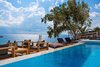 Modern home with Outdoor, Swimming Pools, Tubs, Shower, Back Yard, and Trees. Outdoor furniture with clean lines introduce warm wood tones that fit in with the surroundings. Photo 12 of Myconian Ambassador Hotel