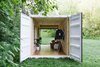 Modern home with Shed & Studio. The interior is warmed by parquet flooring and Finium wood panels. Photo of 20 Ideas On What You Can Do With Old Shipping Containers