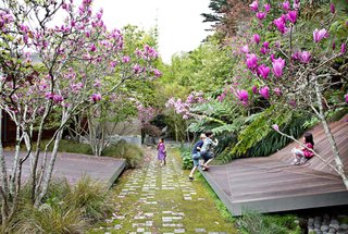 Faceted forms clad in ipe slats provide an unexpected theater for fun in Tiburon, California. The landscape, by James Lord and Roderick Wyllie of Surfacedesign, was created for a family with young children. A walkway of pavers arranged in braille spells out a poem by Christopher Marlowe; this element was conceived by local landscape architect Topher Delaney.