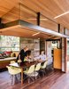 Modern home with Dining Room, Bench, Chair, Table, Dark Hardwood Floor, Recessed Lighting, Ceiling Lighting, and Pendant Lighting. Mary Blodgett and Carlton Calvin initially approached Fung + Blatt to design a ceramics studio on their Southern California property, which contains a 1950s house by modernist architect Calvin Straub. Photo 2 of Modernist Gem Revival