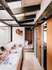 Modern home with Bath Room and Freestanding Tub. Fung + Blatt designed the master bathroom vanity, which features Agape washbasins and fixtures and an angled mirror that reflects the oak trees seen through the skylights. Photo 6 of Modernist Gem Revival